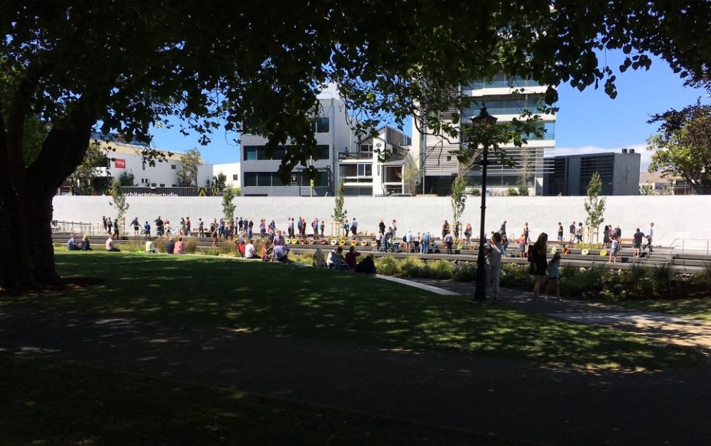 The south bank of the memorial from the shade of trees on the north bank