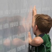 EQM Photo of memorial wall with young boy 22022017